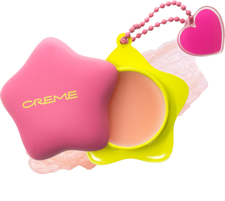 The Crème Shop front packaging showing cute keychain and compact balm