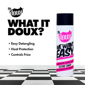 Applying The Doux on damp curls to hydrate and prep for styling