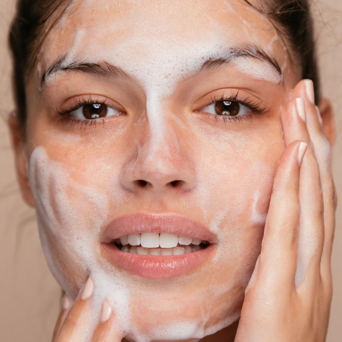Close-up of creamy foam texture from The Face Shop showing mild exfoliating particles