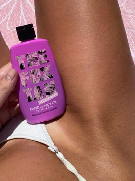 120mL bottle in hand to show The Fox Tan scale, highlights travel-friendly size