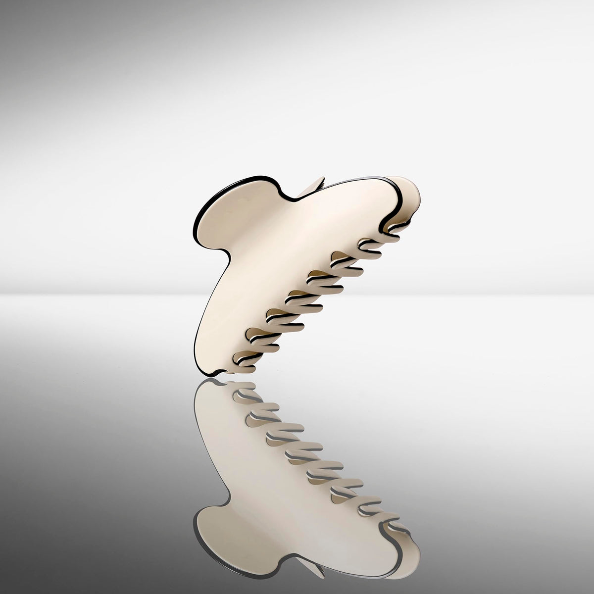 The Hair Edit lifestyle shot styling clip with outfit shows versatile polished accessorizing