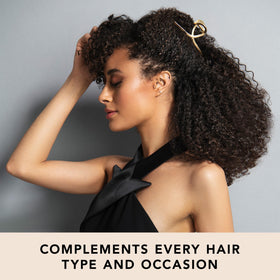 The Hair Edit clip holding a French twist updo for elegant all-day wear