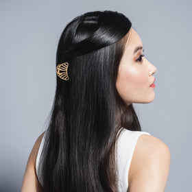 The Hair Edit clips in hair securing a half-up style with elegance