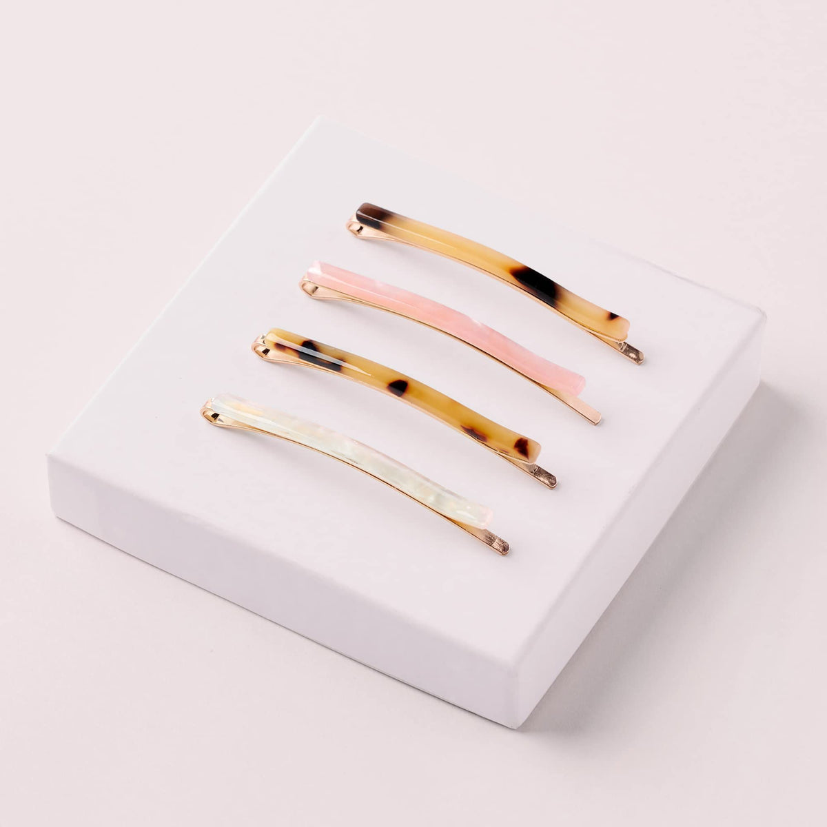 The Hair Edit pins in hair securing a half-up style for quick polished look