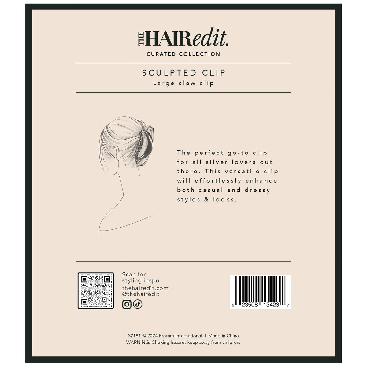 The Hair Edit placed on dresser beside outfit showing accessory-ready, polished look