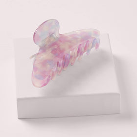 The Hair Edit Unicorn Clip holding a neat updo to show reliable grip and quick styling