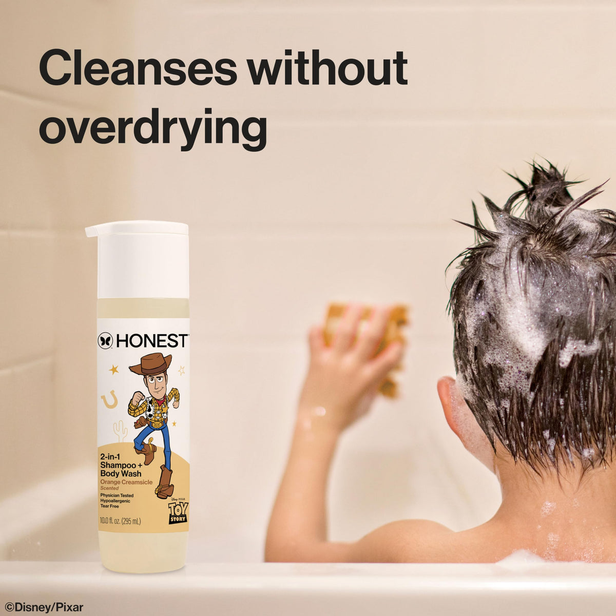 The Honest Company creamy lather in hand demonstrating mild cleansing