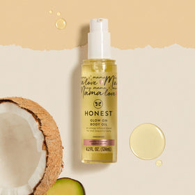 The Honest Company bottle held in hand, 4.2 fl oz size reference