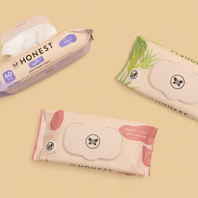 Close view of The Honest Company label ingredients list highlighting naturally derived benefit