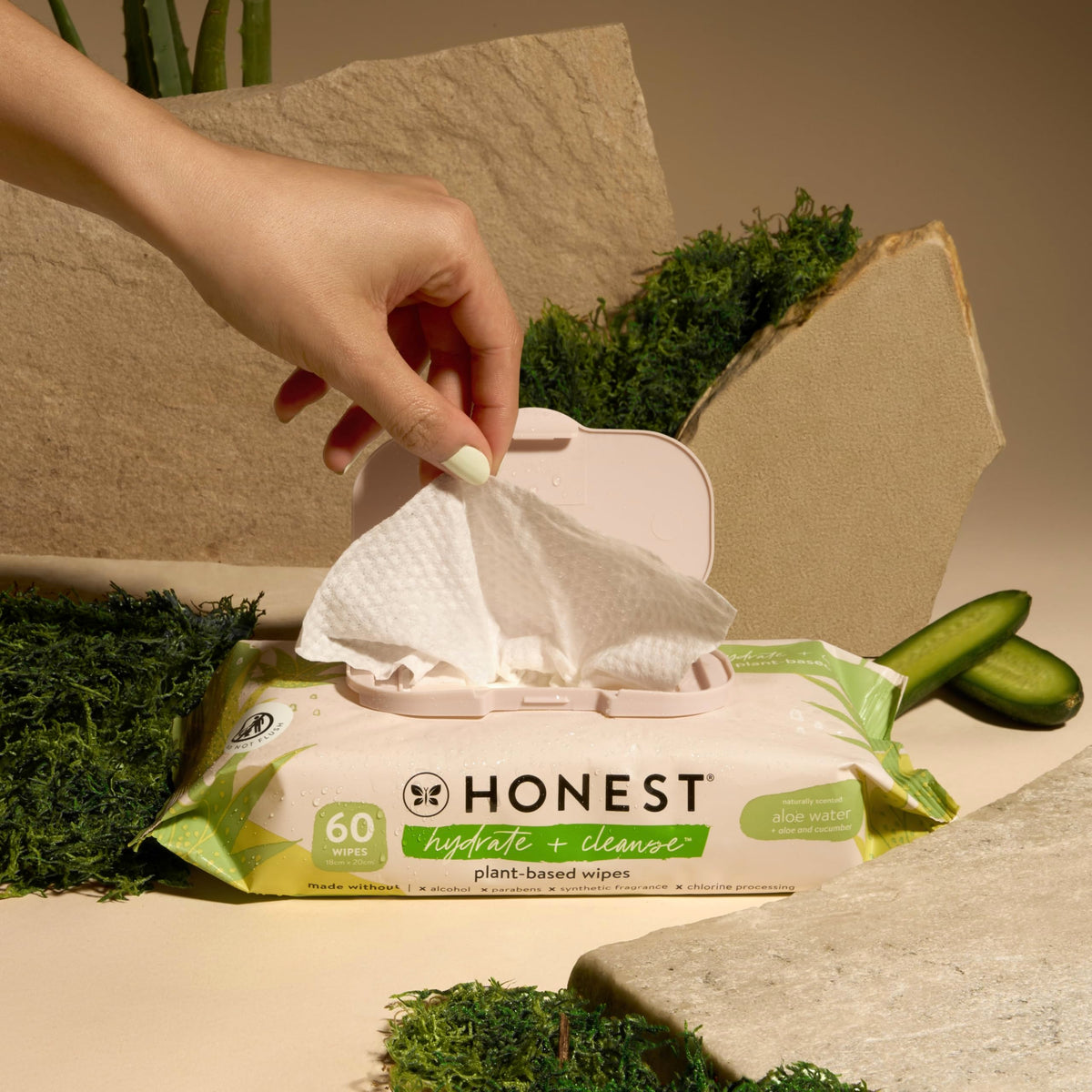 Pack opened with wipe mid-dispense from The Honest Company for easy access benefit