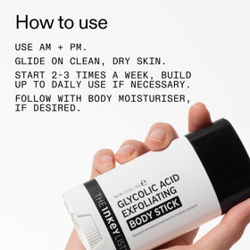 Hand holding The INKEY List stick to show compact travel-friendly size