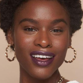 Evening lifestyle shot with The Lip Bar Drama Queen completing a dramatic look