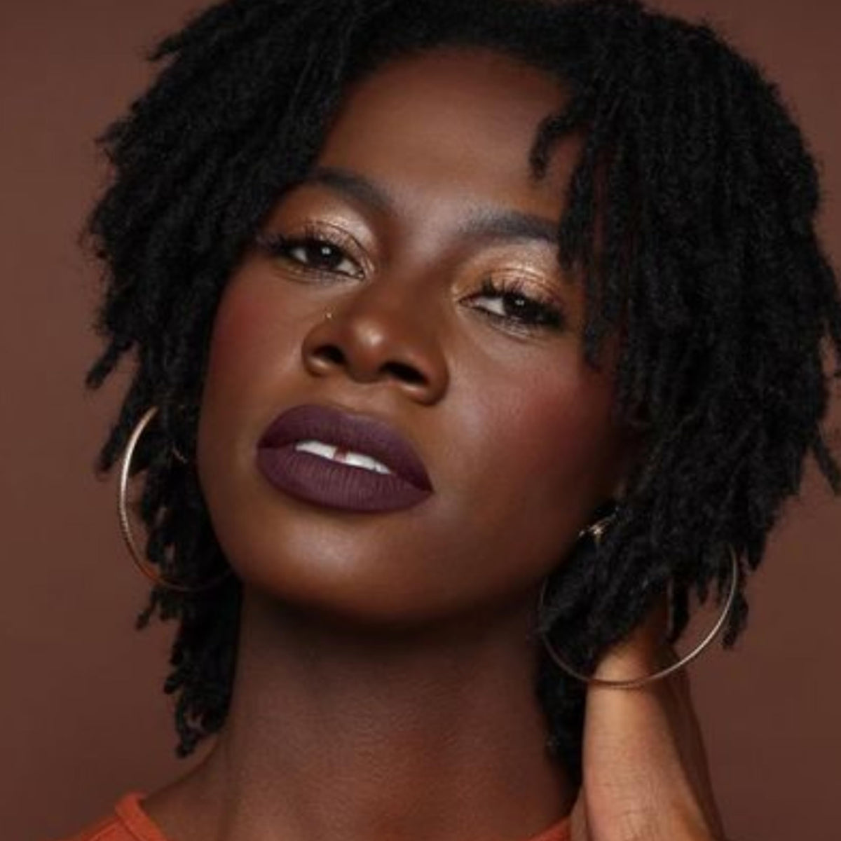 The Lip Bar Drama Queen paired with gloss demonstrating versatile matte-to-shine styling