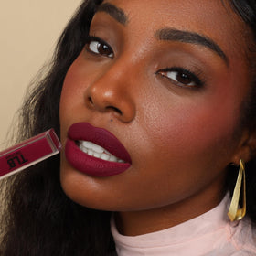 The Lip Bar duo in hand for scale, travel-ready size and convenience