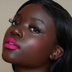 the lip bar fuchsia cap and label detail highlighting branding and ingredient-conscious benefit