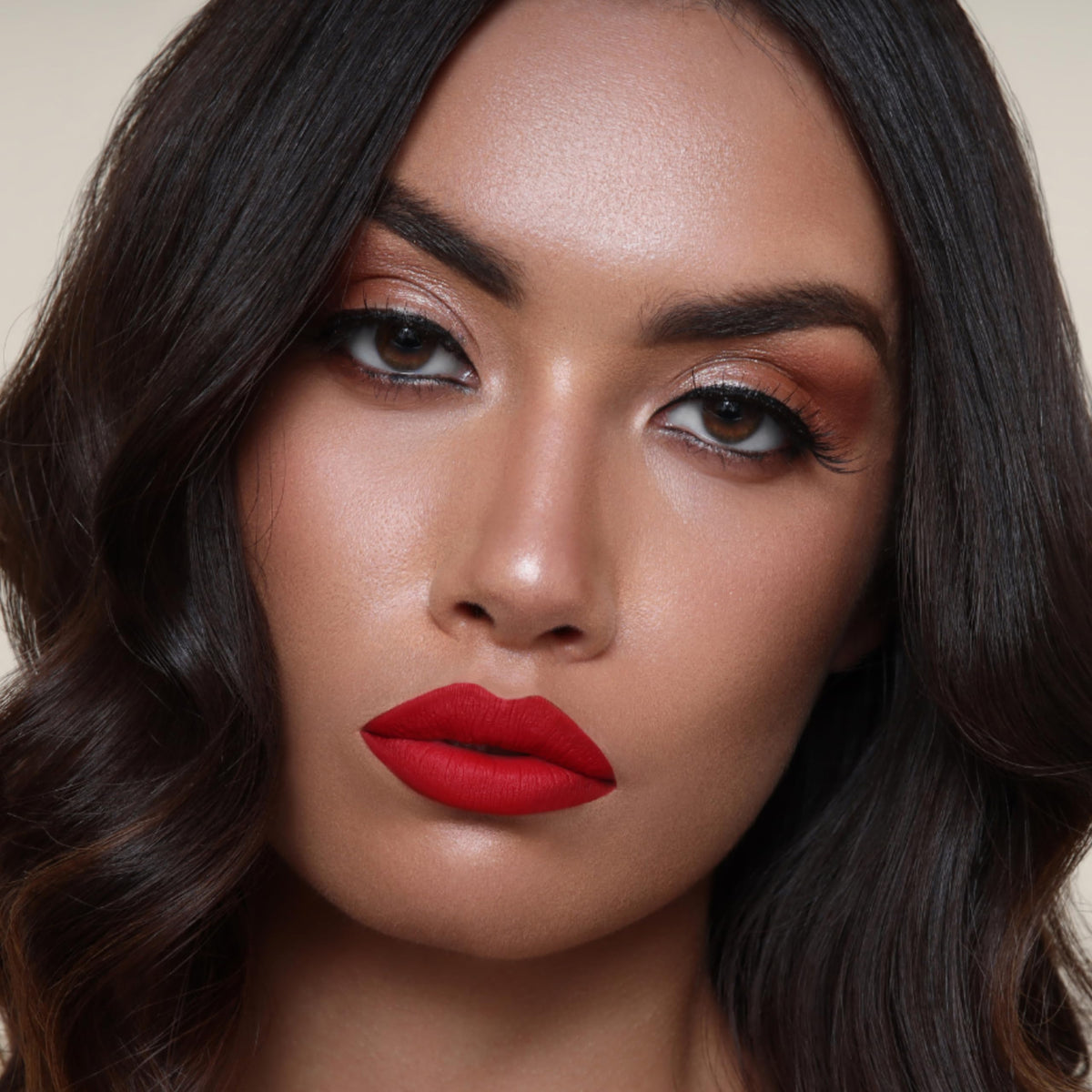 The Lip Bar Hot Mama layered with gloss adds shine and customizable finish
