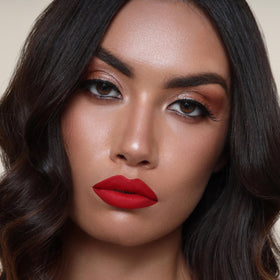 The Lip Bar Hot Mama layered with gloss adds shine and customizable finish