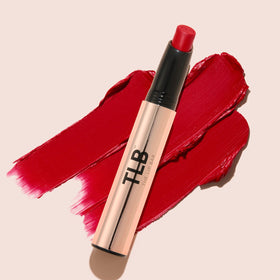 The Lip Bar application on lips illustrating Muse deep berry and comfortable matte finish