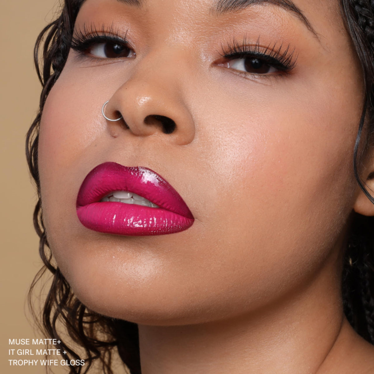 The Lip Bar Muse ingredients label close-up highlighting jojoba oil and vitamin E benefits