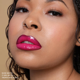 The Lip Bar Muse ingredients label close-up highlighting jojoba oil and vitamin E benefits