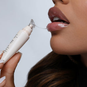 The Lip Bar on hand scale comparison indicating compact size and travel convenience