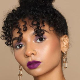 The Lip Bar Prima Donna in hand for size and portability, perfect for touch-ups