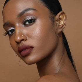 The Lip Bar Savage ingredients label highlighting jojoba oil and vitamin E