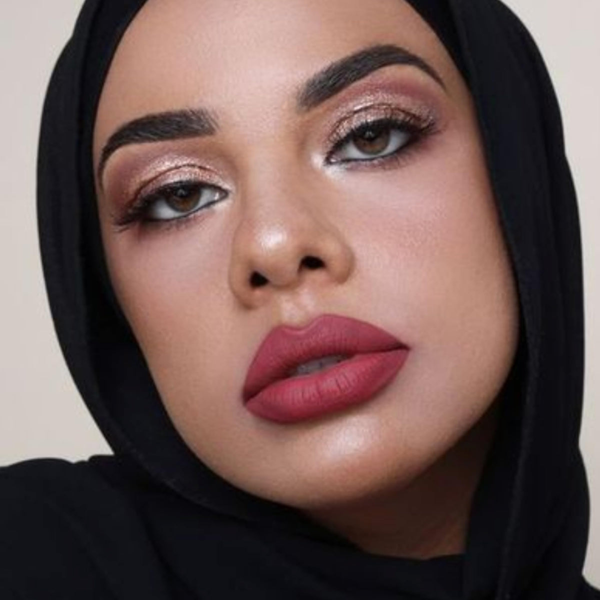 The Lip Bar layered with gloss illustrating shine-over-matte option and versatile styling