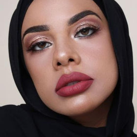 The Lip Bar layered with gloss illustrating shine-over-matte option and versatile styling