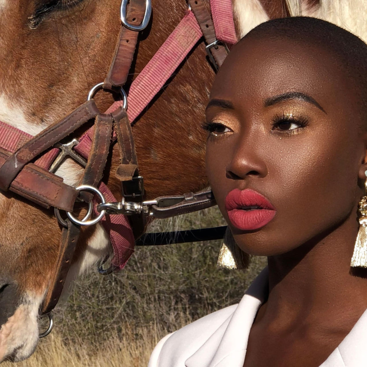 The Lip Bar applied on model smiling showcasing Unimpressed on lips for confidence boost