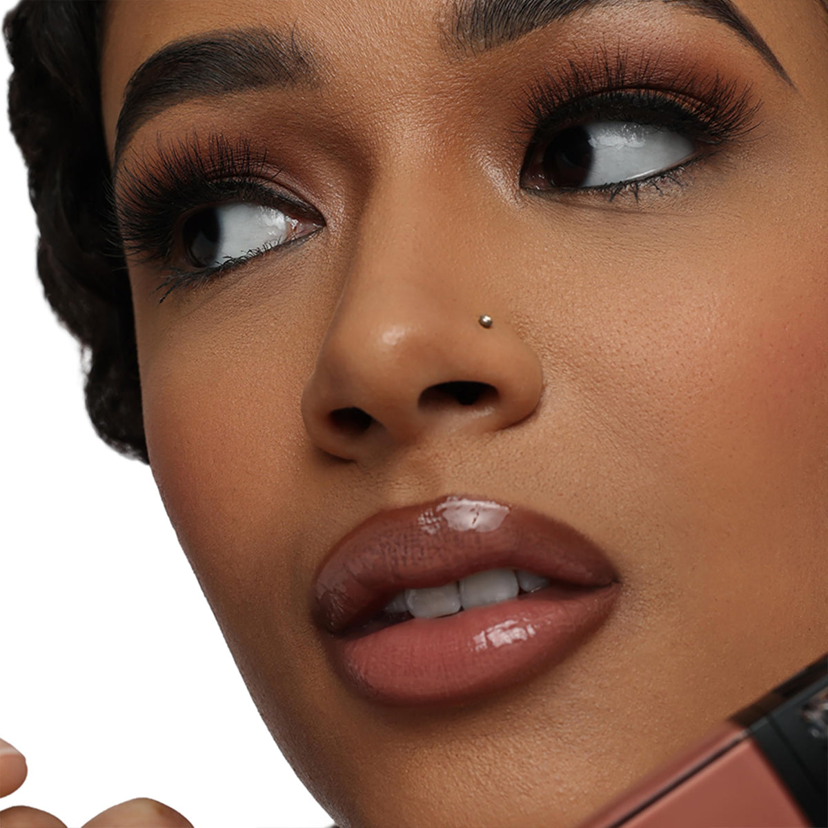The Lip Bar arm swatch of nude pink showing sheer wash of color