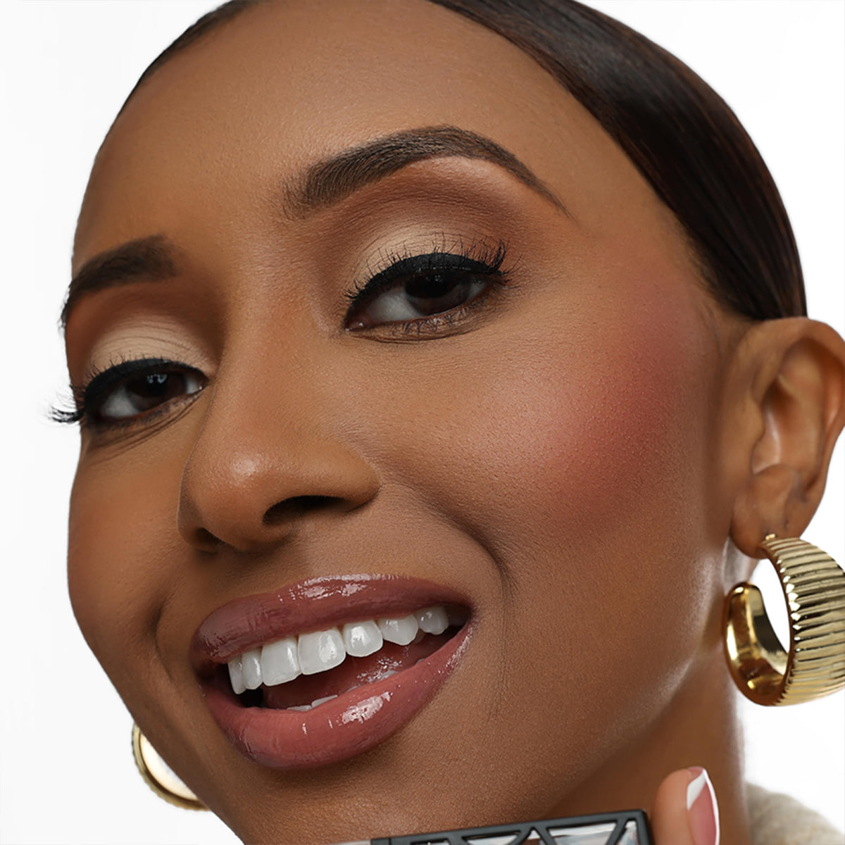 The Lip Bar doe-foot applicator delivering precise gloss application