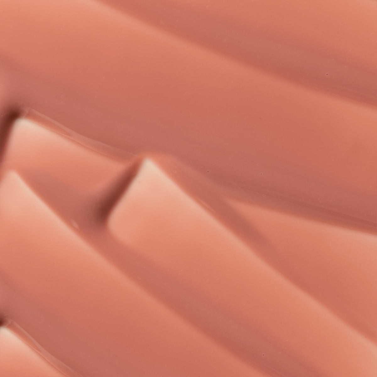 The Lip Bar model applying gloss for instant polished, moisturized lips