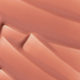 The Lip Bar model applying gloss for instant polished, moisturized lips