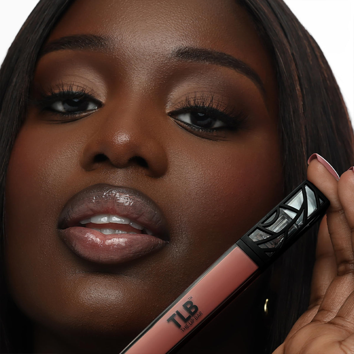 The Lip Bar gloss texture drop highlighting silky non-sticky shine