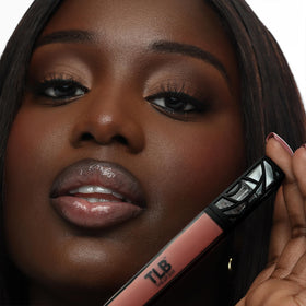 The Lip Bar gloss texture drop highlighting silky non-sticky shine