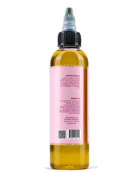 The Mane Attraction on a bathroom shelf with towel, lifestyle hydration and care