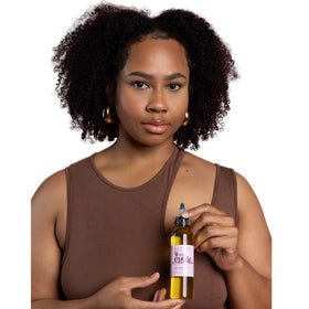 The Mane Attraction used on braids and locs, safe for protective styles and moisture