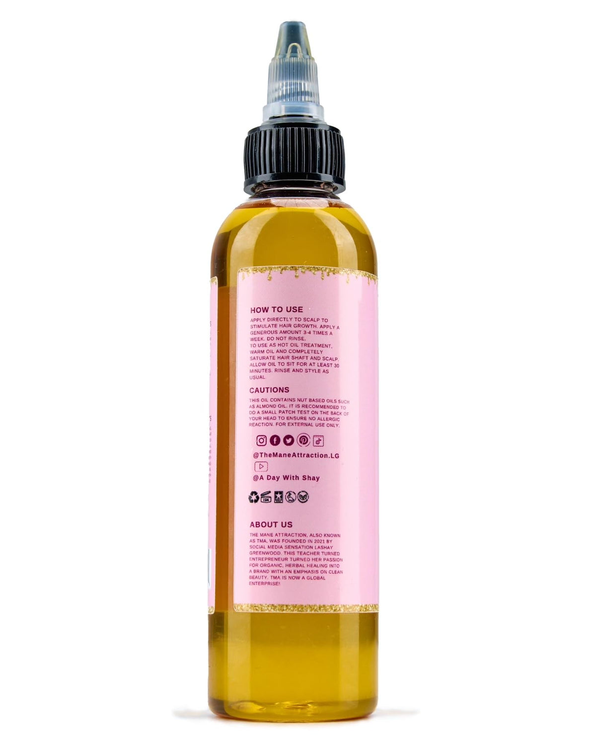 The Mane Attraction bottle beside a ruler showing 4 fl oz scale, practical size