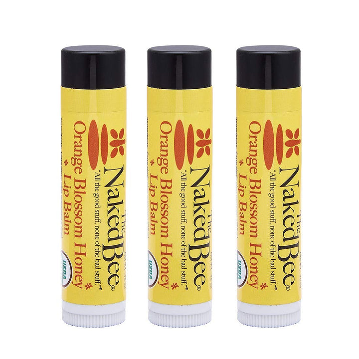 The Naked Bee front packaging showing three balms and clean ingredients benefit