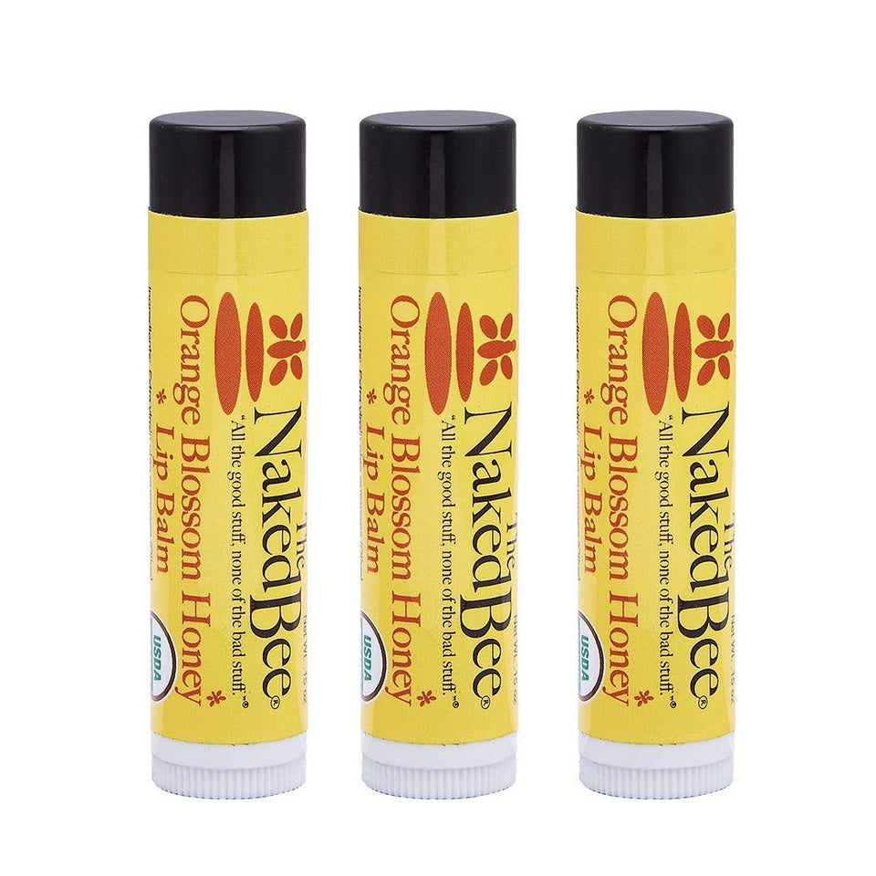 The Naked Bee front packaging showing three balms and clean ingredients benefit