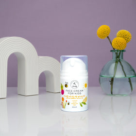 The Natural and Organic Family parent applying cream to child in outdoor family setting