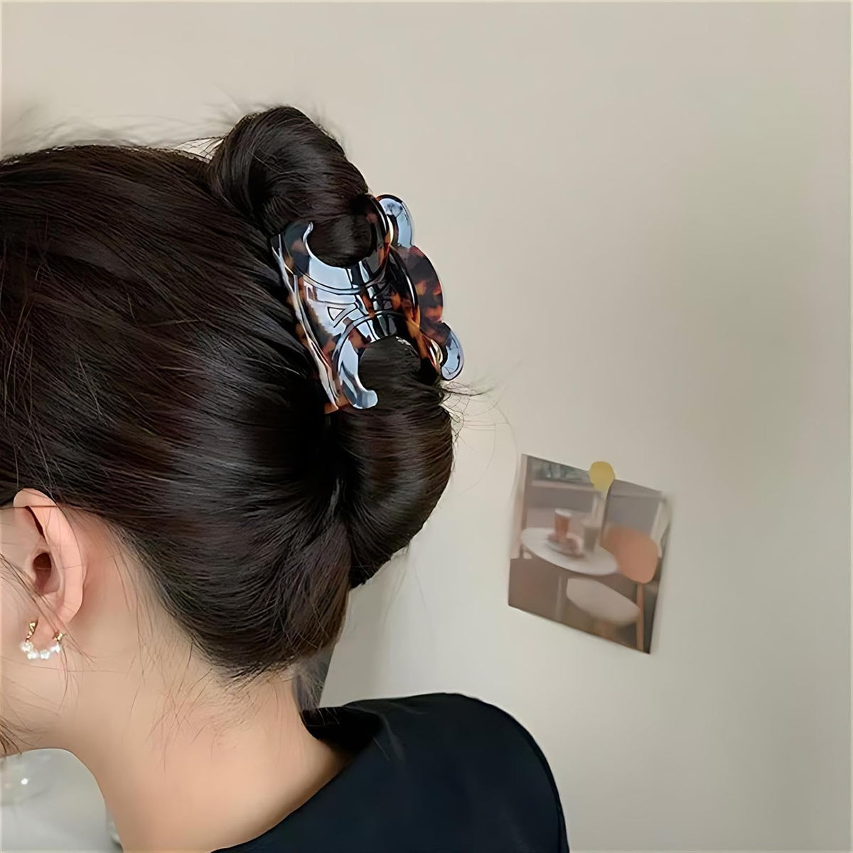 The Only One clip securing a half-up hairstyle demonstrating secure hold benefit