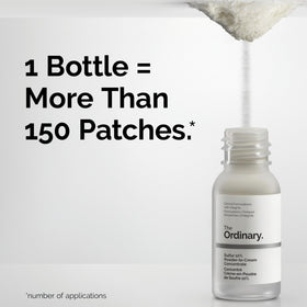 The Ordinary bottle with coin for scale illustrating small travel-friendly size and portability