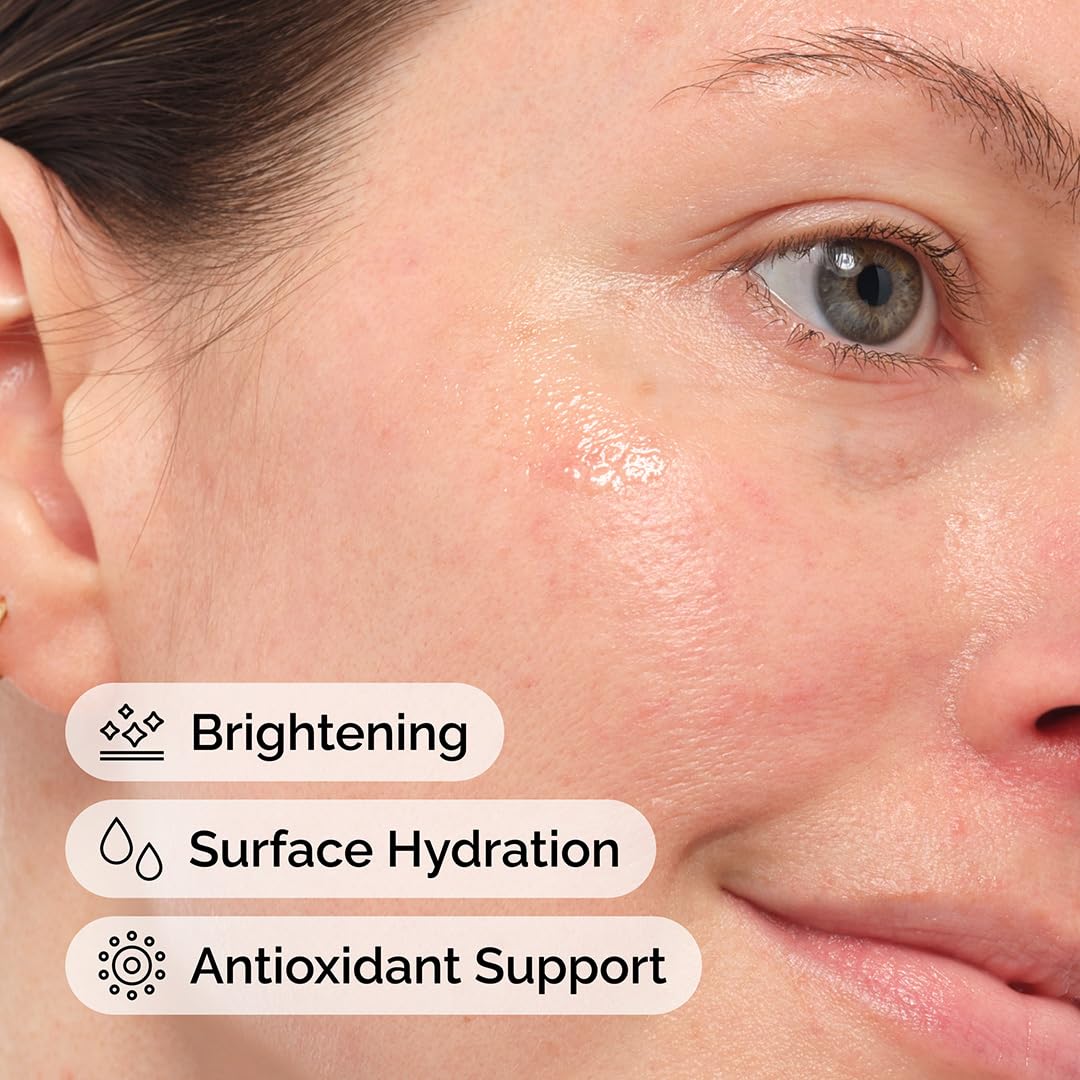 The Ordinary oil being pressed into cheek to boost skin radiance