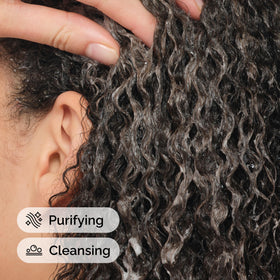 The Ordinary being poured into palm illustrating easy application and control