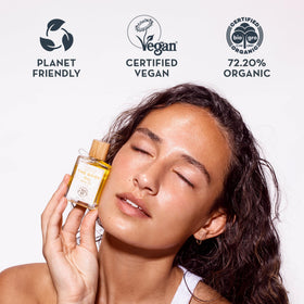 The Organic Skin Co. 30mL bottle next to a coin for size clarity and travel convenience