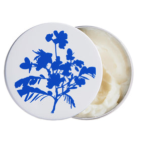 The Outset front tin view showing compact balm and easy portability