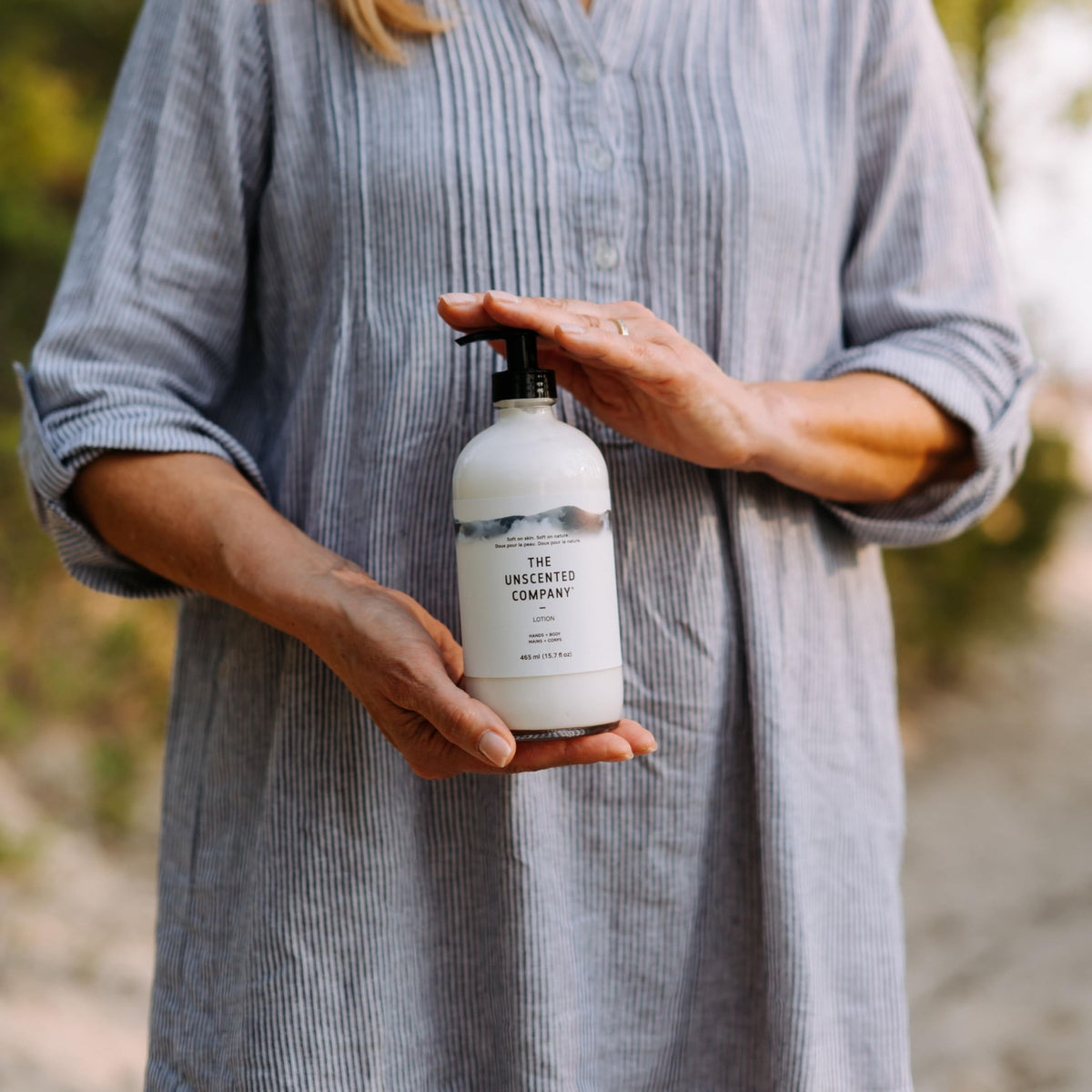 The Unscented Company pump dispensing lotion onto hand for quick hydration