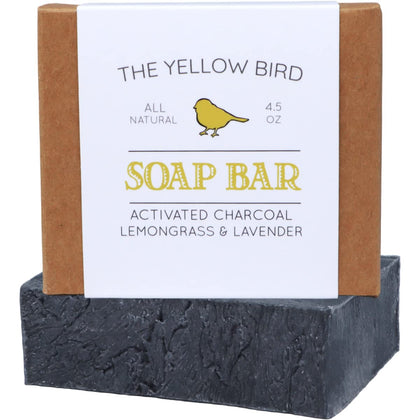 The Yellow Bird soap front packaging showing natural charcoal and organic ingredients benefits